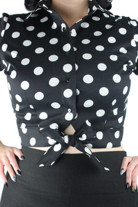 Close up of the knot top, Black material with white large polkadots, Snap up closure, Same fabric throughout
