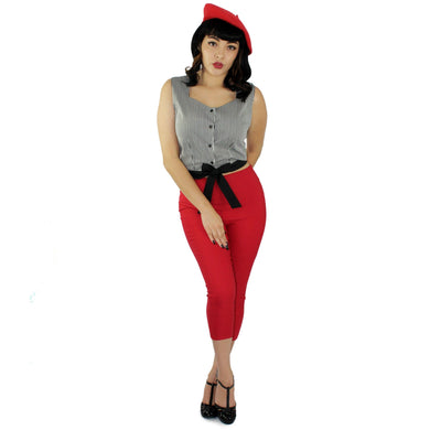 Model wearing the knot top with red capri pants and red cap